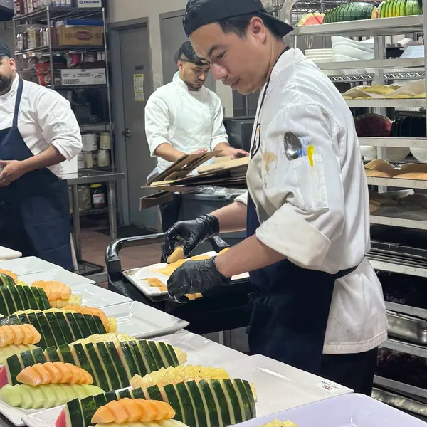 The Cleese team preparing fruit platters in their kitchen
